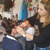 Turkan Panahova, a successful 22 year old hairdresser, attends to one of her many clients.